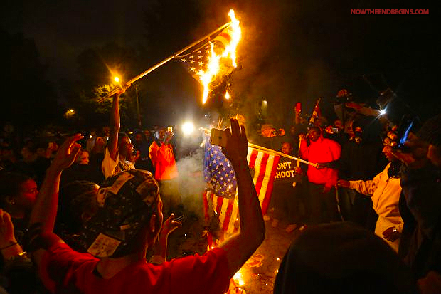 http://www.nowtheendbegins.com/blog/wp-content/uploads/2014/10/ferguson-protesters-st-louis-burn-american-flags-on-grand-boulevard.jpg