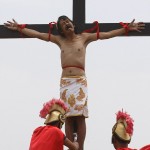 Faux Pain: A Filipino man has nails through his hands - and some more put through his feet as he is put on a cross in the reenactment.