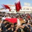 Shiite Muslims in Bahrain carry the coffin of protester killed in clashes with police.