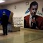 Pennsylvania election law states "no person within a polling place may electioneer or solicit votes for any political party, political body, or candidate, nor may any unauthorized written or printed materials be posted within the polling place."