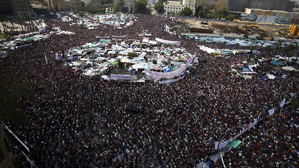 A protester flashes Egypt's