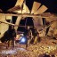 Soldiers examine the damage after a rocket fired from Lebanon hit buildings in northern Israel early Tuesday.