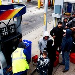 People line up to fill gas containers at the New Jersey Turnpike's Thomas A. Edison service area Wednesday, Oct. 31, 2012, near Woodbridge, N.J. After Monday's storm surge from Sandy, many gas stations in the region are without power and those that are open have very long lines. (AP Photo/Mel Evans)