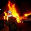 Riots: Occupy Oakland protesters pass a burning rubbish heap during a confrontation with police