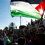 Palestinians hold flags during a Nakba rally in front of Damascus Gate in Jerusalem's Old City May 15, 2012. REUTERS/Ronen Zvulun