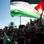 Palestinians hold flags during a Nakba rally in front of Damascus Gate in Jerusalem's Old City May 15, 2012. REUTERS/Ronen Zvulun