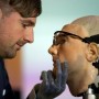 Researcher Bertolt Meyer, a lifelong user of prosthetic technology and the model for 'Rex', the world's first 'bionic man', poses with the humanoid during a photo call at the Science Museum in London on February 5, 2013. The 640,000 GBP (1 million US dollars) bionic has a distinctly human shape and boasts prosthetic limbs, a functional artificial blood circulatory system complete with artificial blood, as well as an artificial pancreas, kidney, spleen and trachea. Rex will be displayed at the Science Museum from February 7.