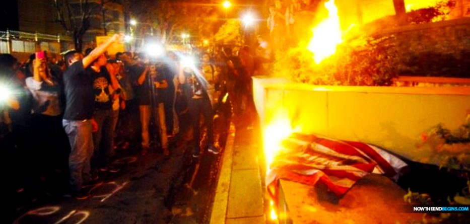 honduran-migrants-burn-american-flag-george-soros