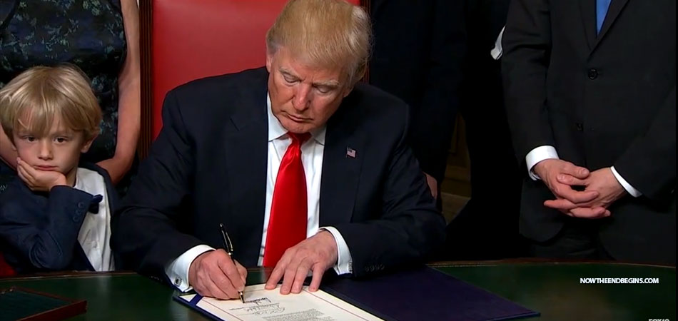 president-donald-trump-signs-first-executive-orders-while-obama-giving-farewell-speech