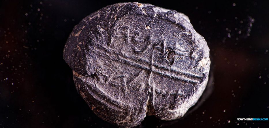 A small 7th century BCE clay sealing reading 'Belonging to Adoniyahu, Royal Steward,' recently discovered in the City of David's sifting project, taken from earth excavated under Robinson's Arch.